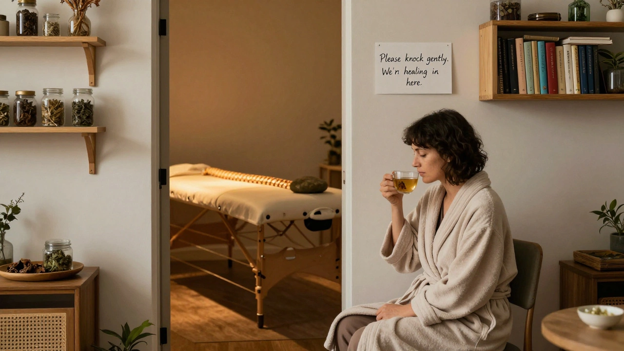 A client sipping tea in a peaceful waiting area with books and dried herbs, hinting at restorative calm.